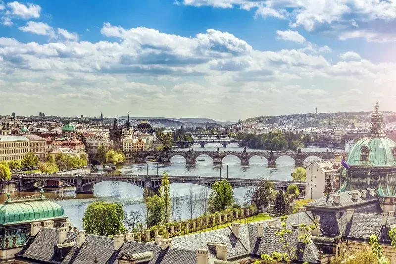 Prague from above with its beautiful bridges and architecture on a sunny day. This is one of the most complicated countries with nomadic visas because of the strict requirements.