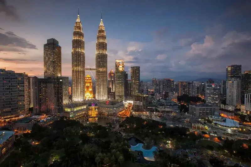 Picture of downtown Kuala lumpur skyline in Malaysia at night.