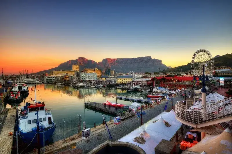 A beautiful picture of a South African town at sunset along the docs.