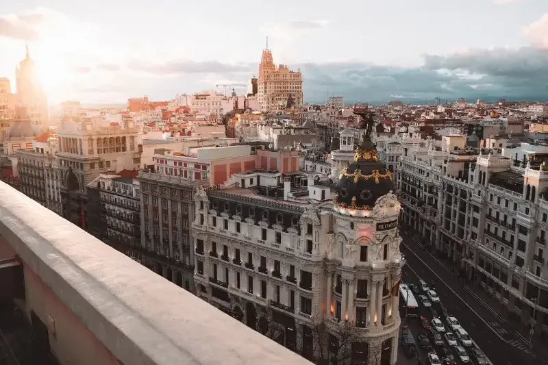 Madrid as seen from a tall building in the center of town at sunset.