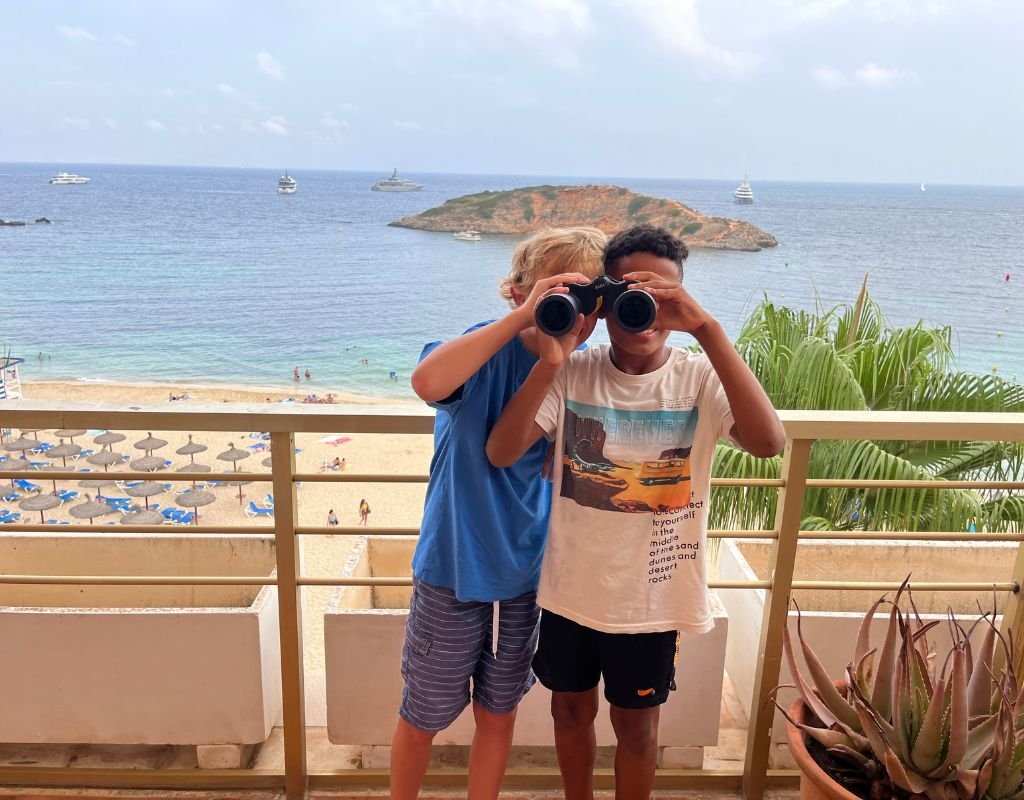 Colleen's son with a friend down at a beach in Mallorca. Digital nomad families can spend more time doing family activities because of their flexible schedules.