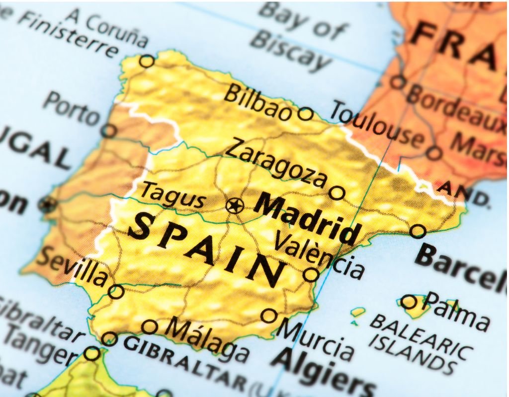 A map of Spain highlighting key cities like Madrid, Valencia, and Seville, vital cultural hubs. To get Spanish citizenship, residing in one of these historic places could be a significant step.