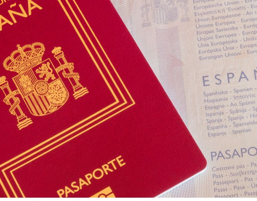 A close-up of a Spanish passport on a textured background, symbolizing identity and belonging. Spanish nationality requires years of legal residence and a commitment to Spanish culture.