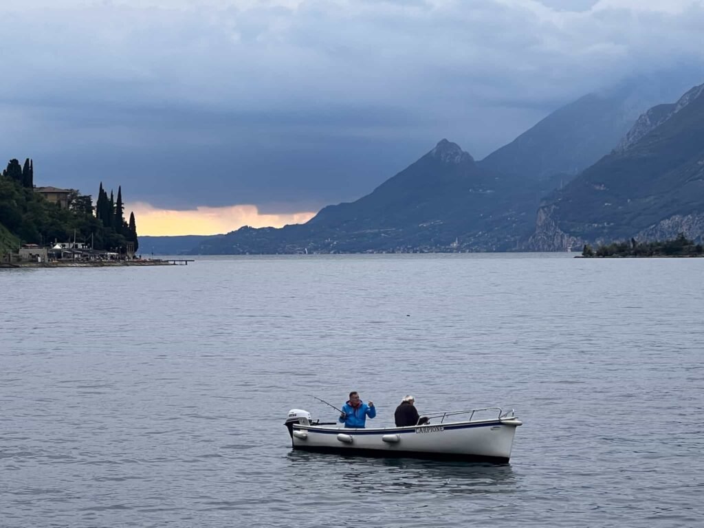 Our friends on a boat went fishing in Lake Garda.