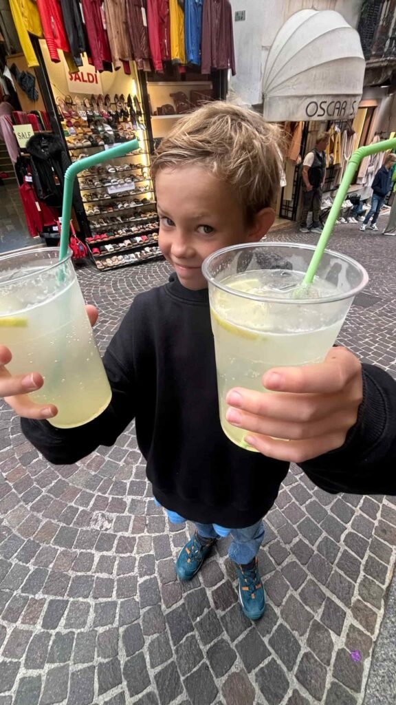 My son holding some lemonades.