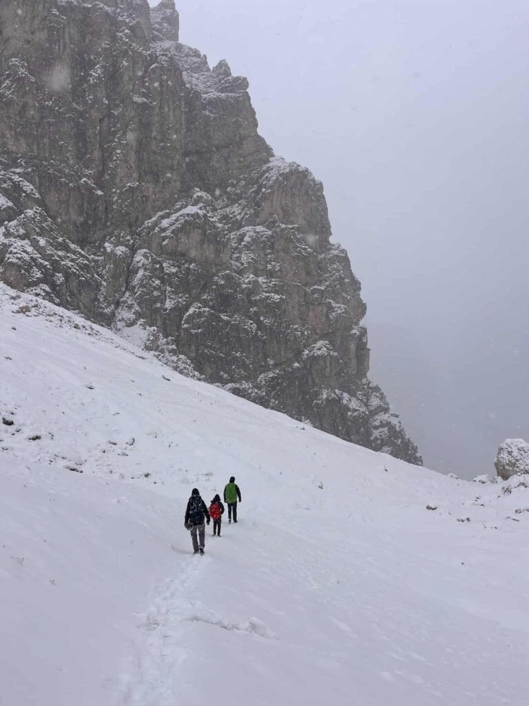 Hiking in Dolomites during blizzard.